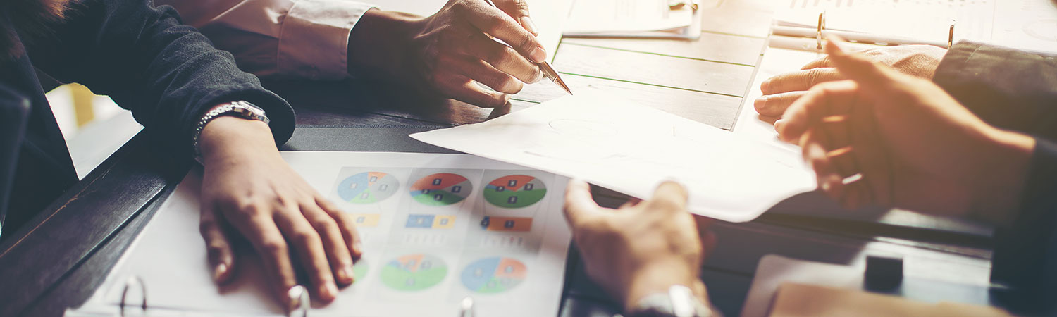 A group of people reviewing reports