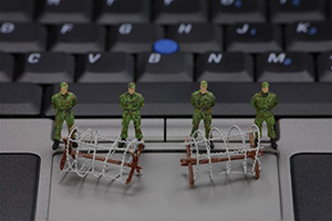 mini soldiers protecting a keyboard